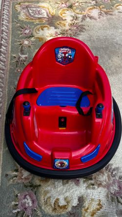 Smoke free pet still in brand new condition Electric bumper car is made of durable red and blue plastic. It has a 360-degree spin capability with dual