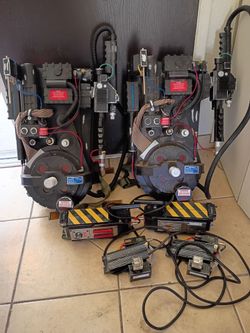 2 Spirit Halloween Life Size Proton Packs and 2 Deluxe Traps