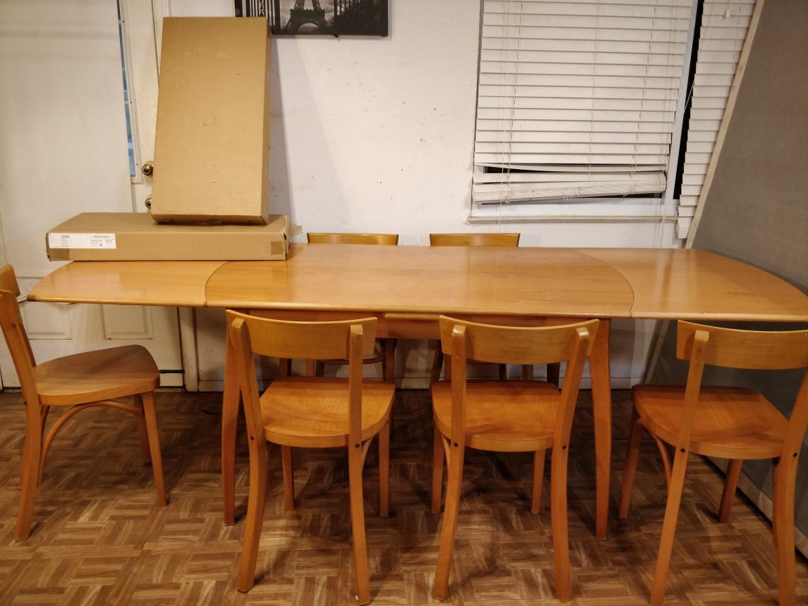 Nice wooden dining table with 8 chairs in good condition, 2 chairs still in box. L(86/53)"*W35"*H29.5"