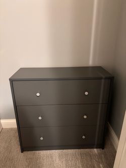 Gray 3-drawer dresser.
