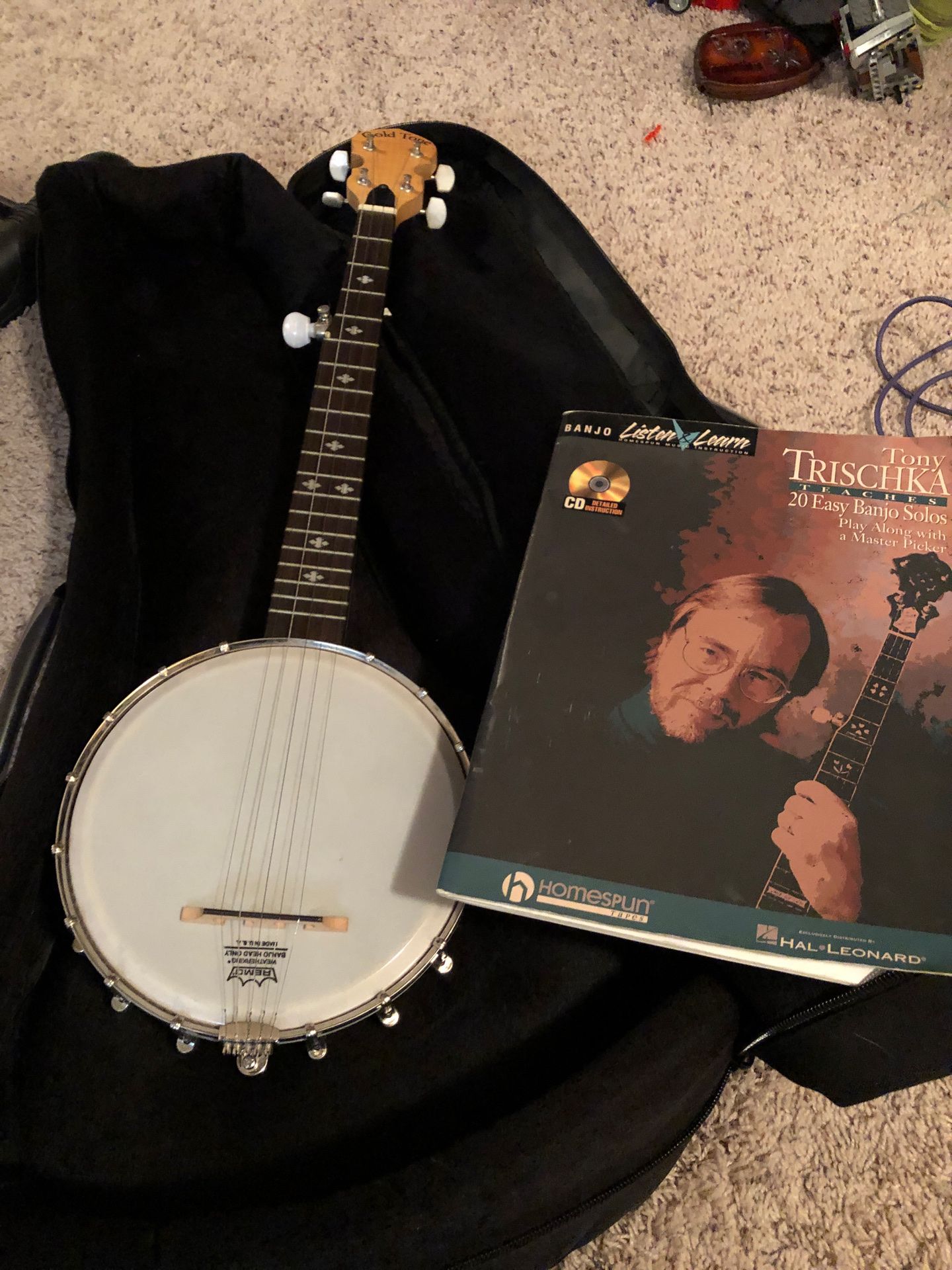 Banjo and case and playbook and case