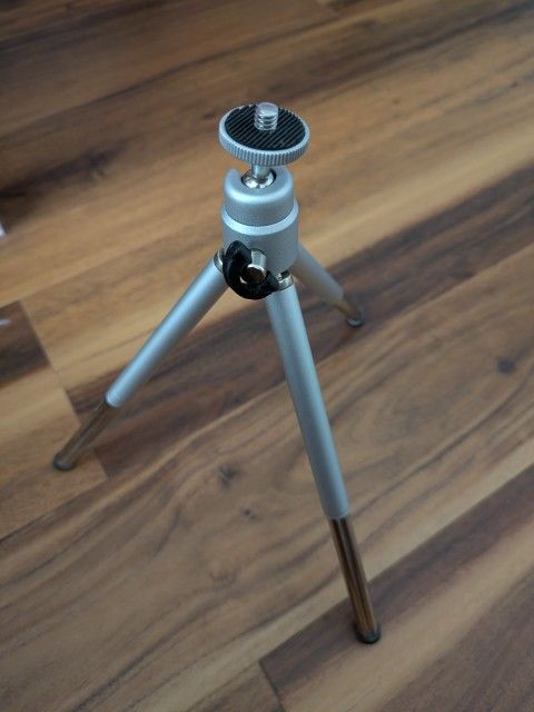 Metal mini tripod for cameras. Brand new, never used, still in package. See pictures for details and size. See my other items available.