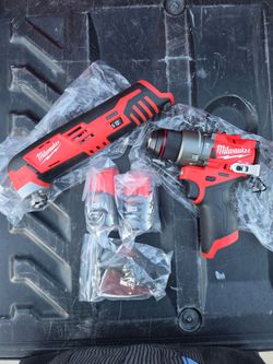 Milwaukee Fuel M12 1/2" drill driver/ Milwaukee multi tool and 2 1.5 lithium ion batteries