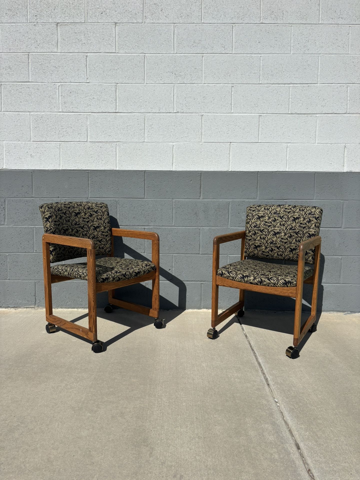 Pair of Vintage Leaf Upholstery and Wood Rolling Chairs