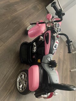 Motorcycle powerwheel with charger