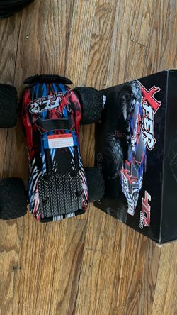 It comes with 2 batteries and one charger and a rc part