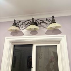 Over a vanity light fixture
