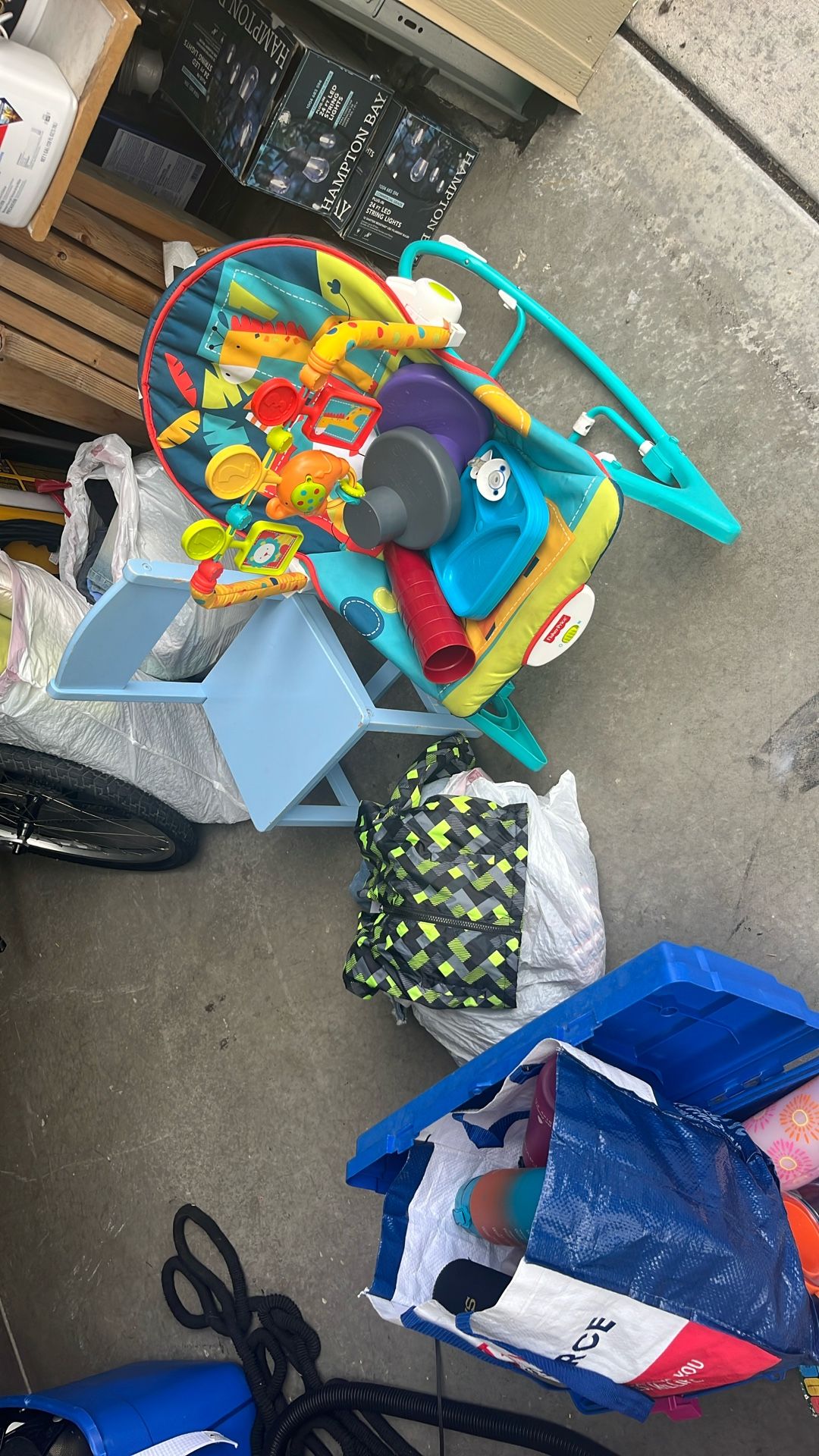 Baby carrier plays music and vibrates with baby utensils chair and baby clothes all for $25