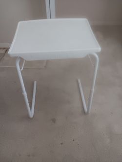 Small white plastic table. Selling for $10