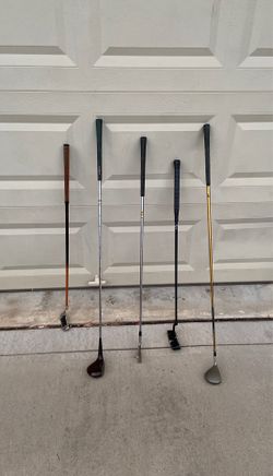 Assorted golf clubs