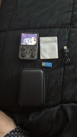 Anabernic clear purple handheld game with 34k games loaded