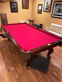 Pool Table- 8’ x 44” playing surface.  Solid Maple rails.  Good condition.  Includes cover, sticks, balls,  wall rack and other accessories. $450 or b