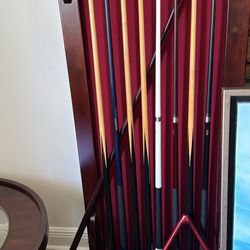 Pool Table Wall Unit With Sticks.