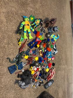 Assorted toys, Godzilla and King Kong and transformers, etc
