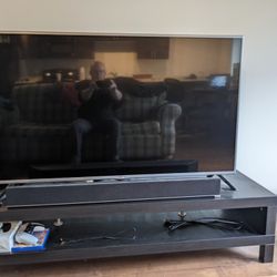 TV, Sound Bar, and TV Stand