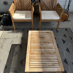 2 Outdoor Chairs And A Coffee Table
