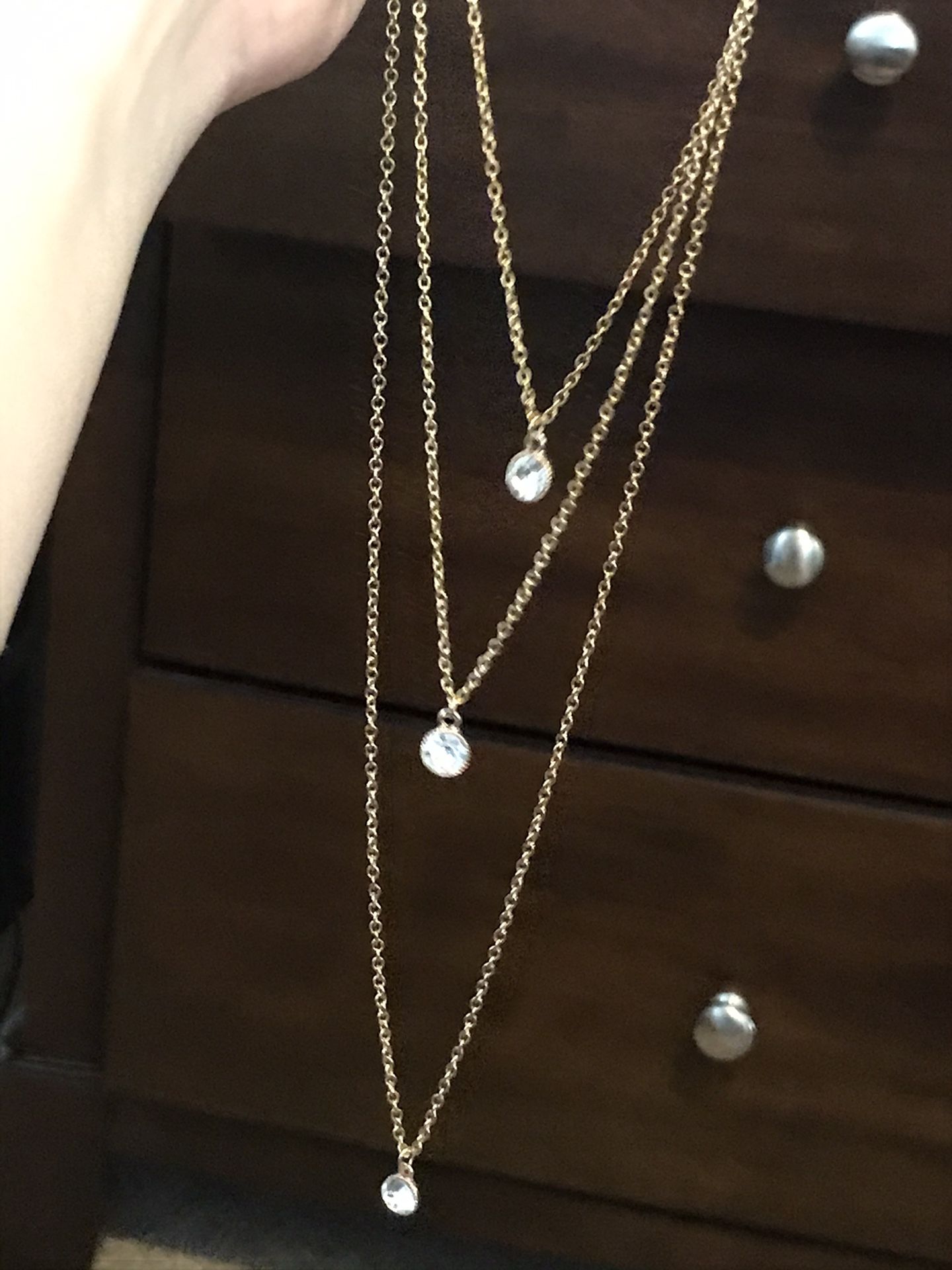 Three piece necklace that, earrings, key necklace and Larry necklace gold color six dollars for all