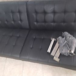 Sofa and bed at the same time, black leather.Good