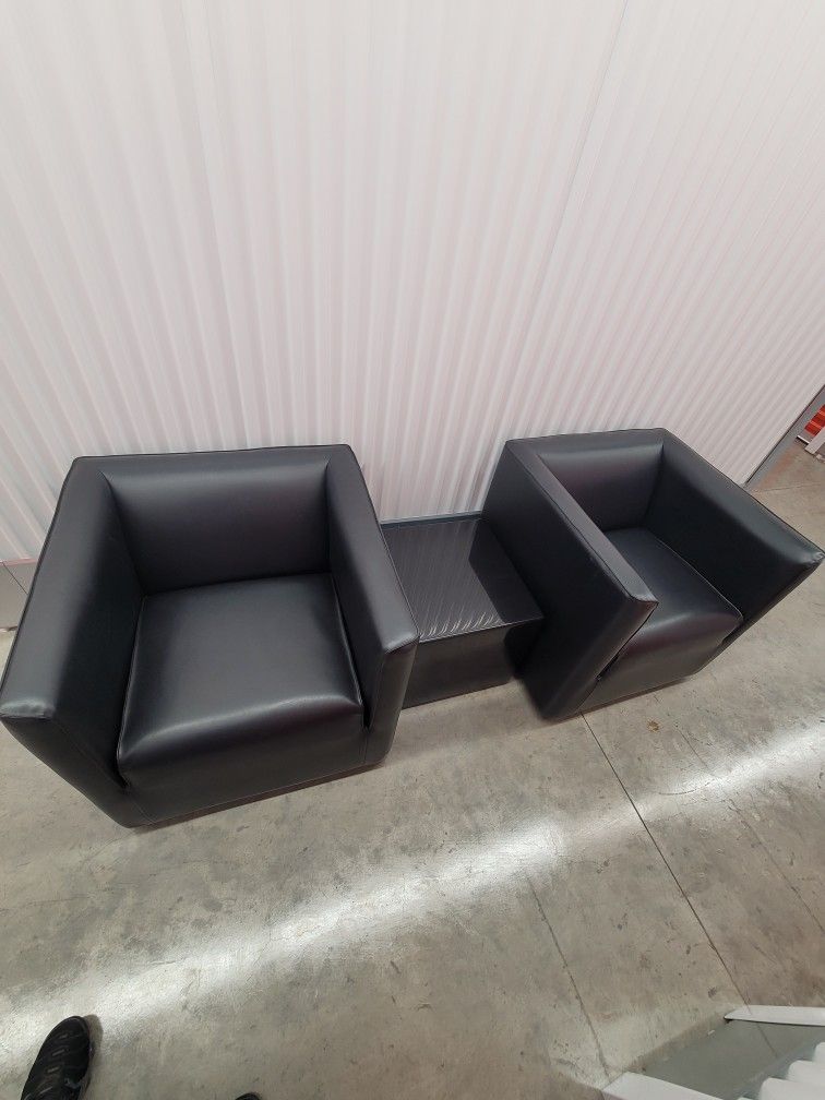 Two Leather Chairs