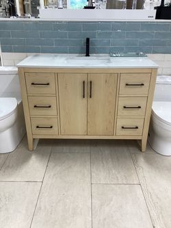 48” solid wood oak vanity, single sink, Quartz stone top, available for pick up
