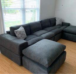 Anchoretta 134” wide reversible modular sectional with ottoman