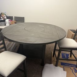 Dining tale woth lazy susan and four chairs