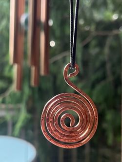 The sacred geometry copper swirl for grounding and clearing energy