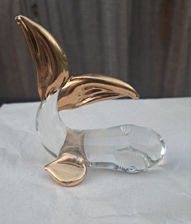 Vintage hand blown glass whale figurine with gold color accents. 