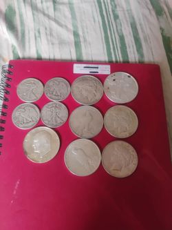 11 coins all silver  7 silver dollars and 4 ,50 cent pieces