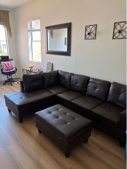 L shaped leather sofa w ottoman
