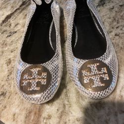 Tory Burch Flats Brand new with beautiful goldtt Symbol in front silver leather brand new
