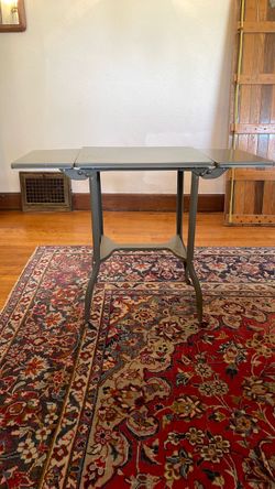Vintage metal side table with castors