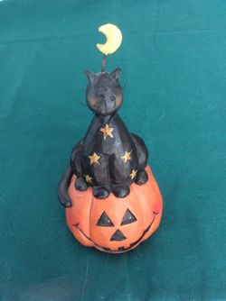Black cat on pumpkin knicknack