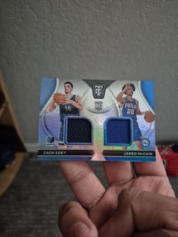 Basketball card with pieces of used jersey from Jared McCain and Zach eden