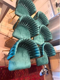 Green velvet dining chairs. Small stain on only 1 chair, practically new! Pick up in Ontario. Purchased for $425. Selling for $300.