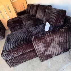 New Black Fluffy U-shaped sectional  with ottoman included.