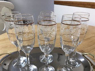 Goblets for champagne , glass decorated with flowers and gold trim
