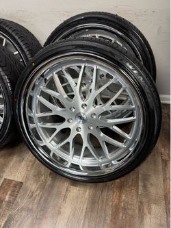 NEW staggered 24x9 and 24x11 infamous wheels polished/ brushed wrapped in Lexani tires