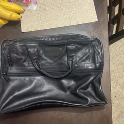 Tumi leather bags 