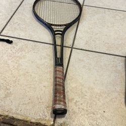 Black Tennis Racket With Brown Leather Handle