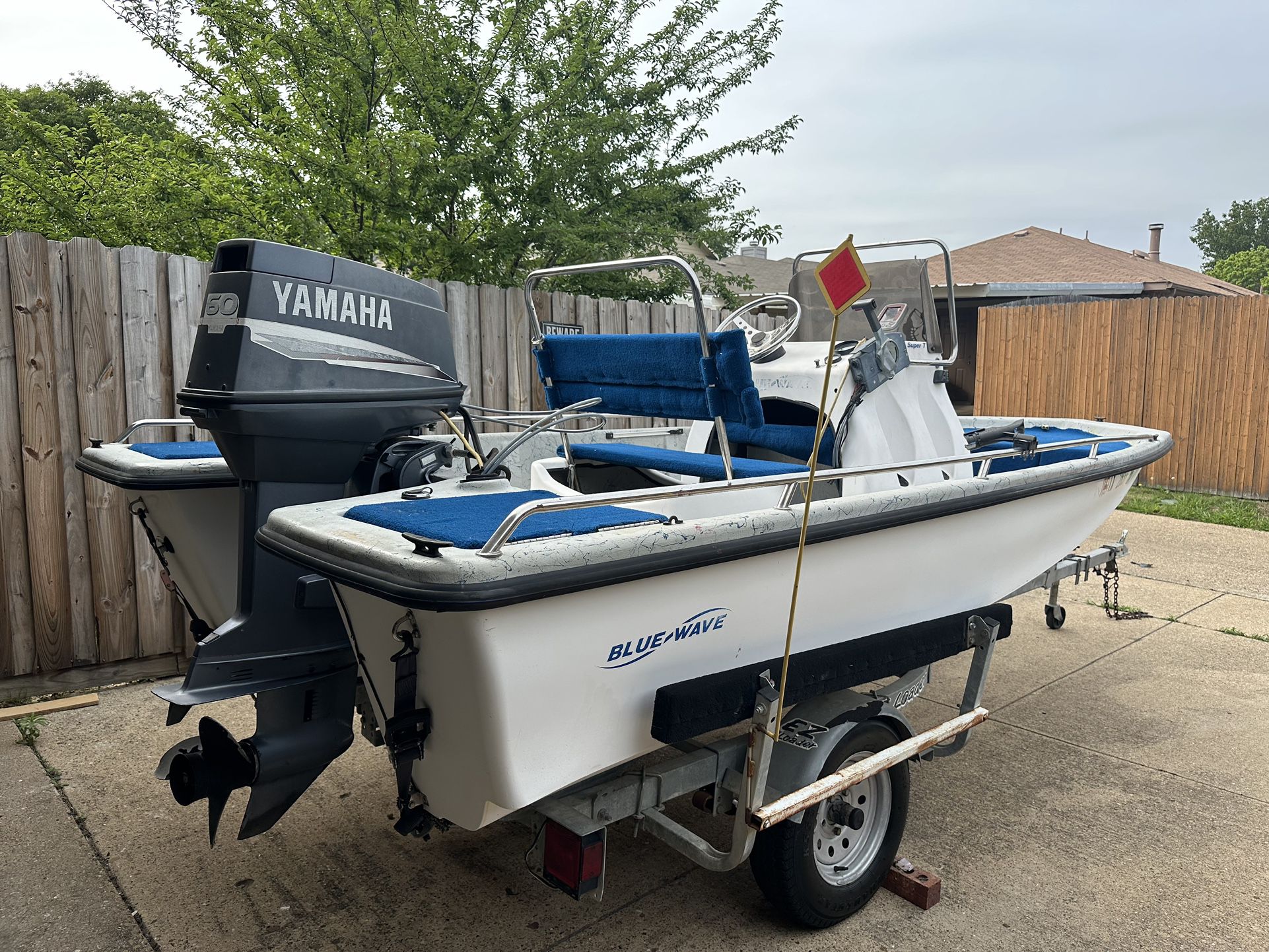  1996 Blue wave center console Boat 165  Powered by 60 horse Yamaha  E z load trailer Motor runs very strong  