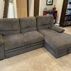 Gray Sectional Sofa with Storage + Pull-Out Sleeper – $375