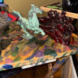 I have two horse miniature miniatures one made out of metal and one made out of wood