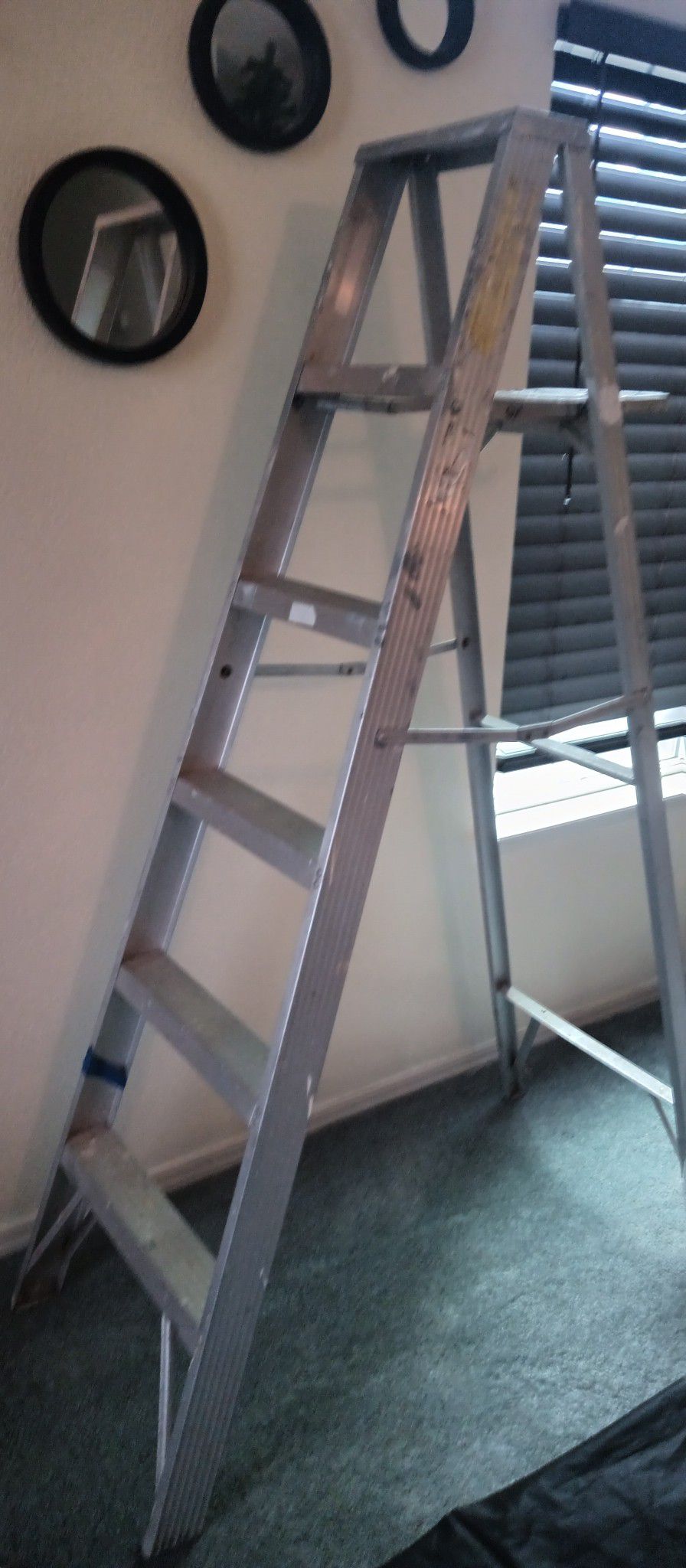 5 1/2 Foot Aluminum Step Ladder. It's Nice And Sturdy.