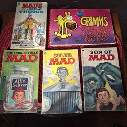 Collection of vintage Mad Magazine paperback books and a "Grimm's Furry Tails" book
