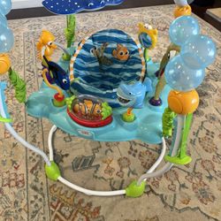 Bright Starts Disney Baby Finding Nemo Sea of Activities Baby Activity Center Jumper with Interactive Toys, Lights, Songs & Sounds, 6-12 Months (Blue)
