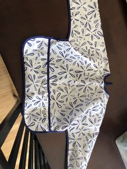 White & purple Nina brand bib.