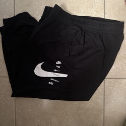 LADIES NIKE SWOOSH 1XL JOGGERS W/ SIDE POCKETS (GOOD SHAPE) NO HOLES/RIPS)
