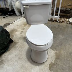 Toilet in good condition and clean, measures 18 inches high and the tank is 18 inches wide.