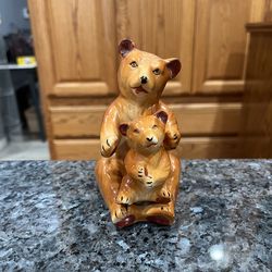 Vintage Mama Bear Holding Baby Cub Bear pair of Salt and Pepper Shakers.  Size approximately 5 inches tall.  Preowned some minor paint wear due to age